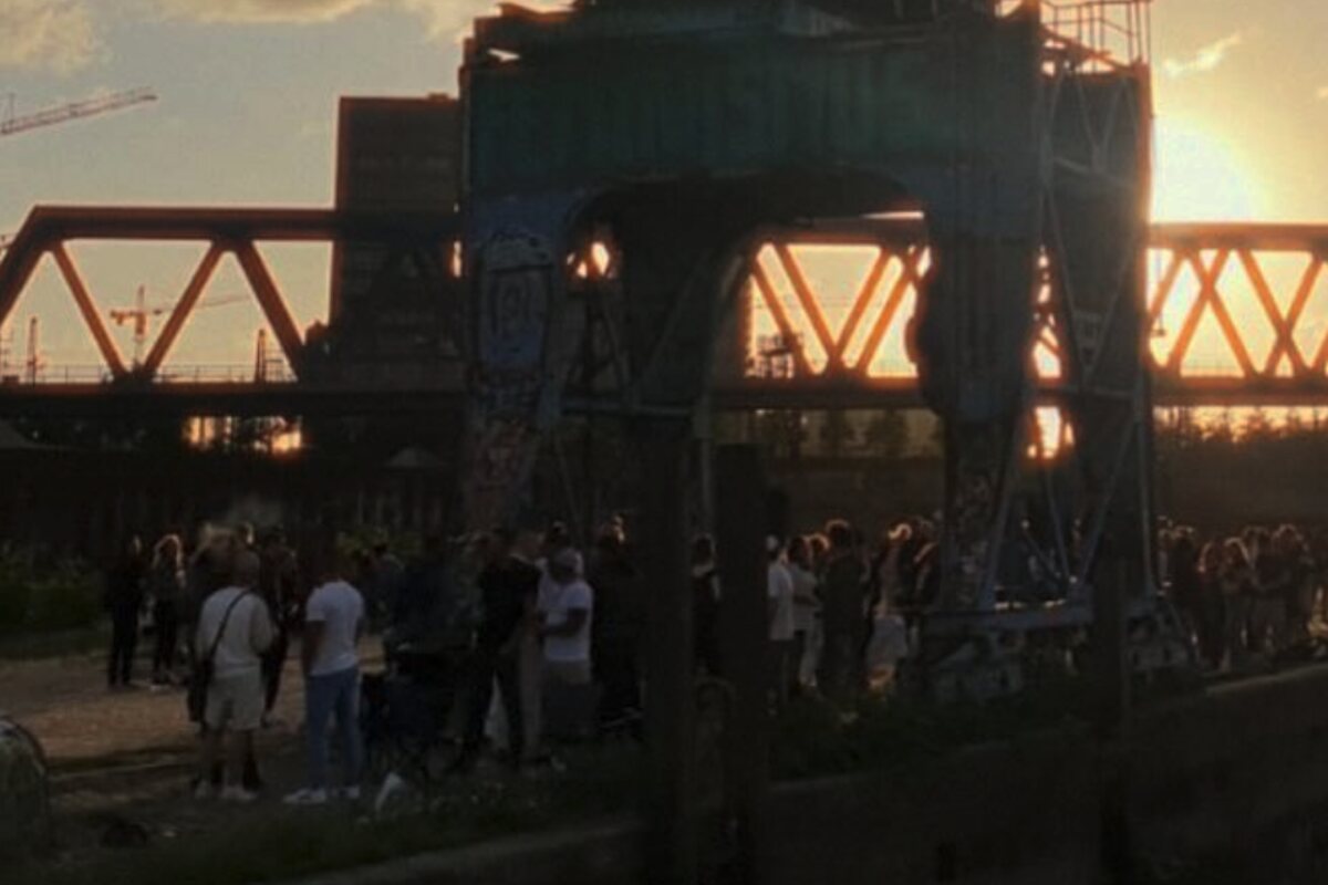 Open-air event at dusk beneath a bridge structure – Electro Bistro, an event series for electronic music running since 2010